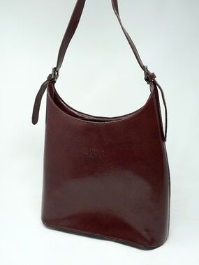Vintage Gucci leather adjustable shoulder bag with silver-toned buckles